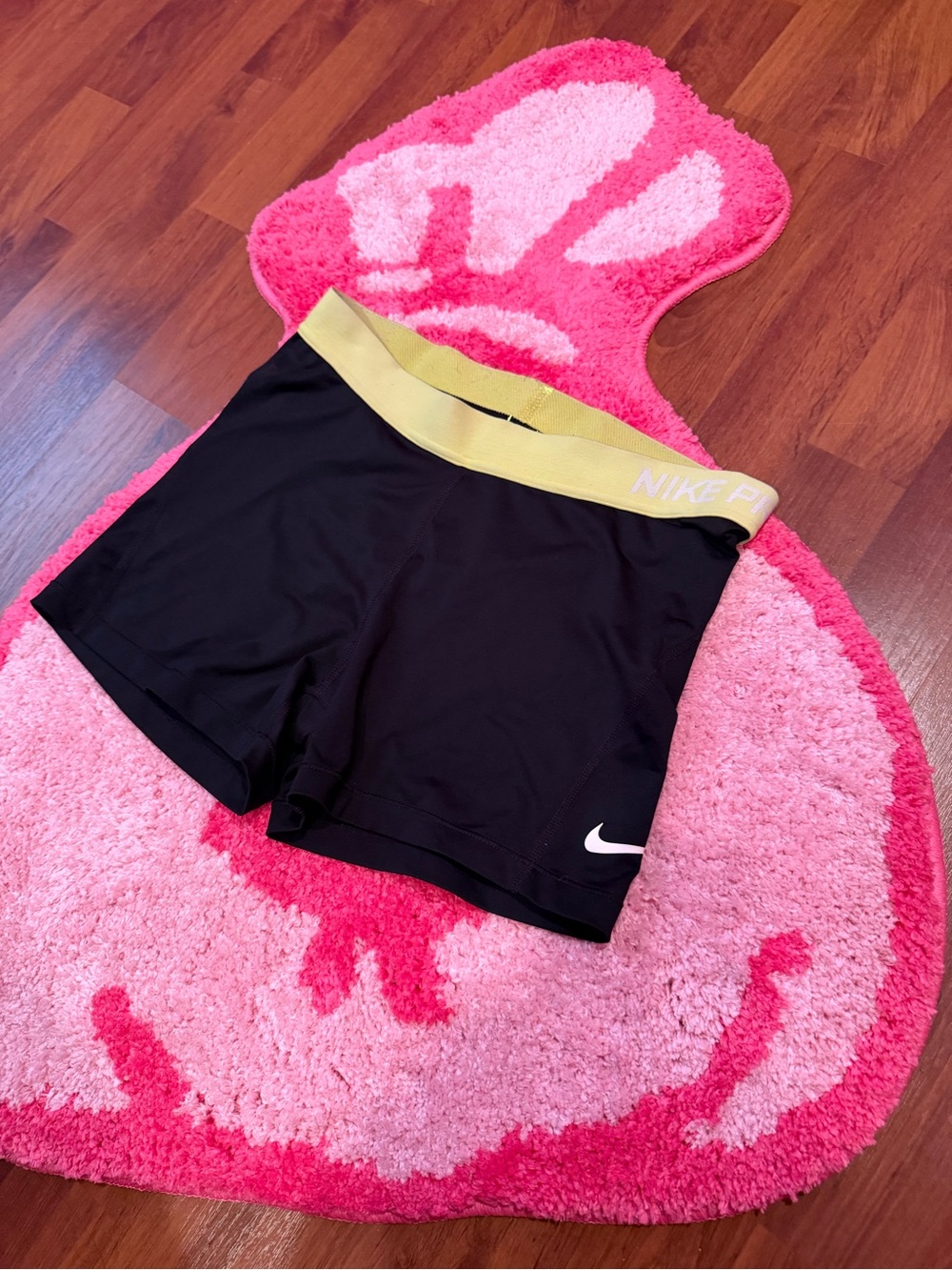 Nike Women's Black Athletic Shorts with Gold Elastic Waistband